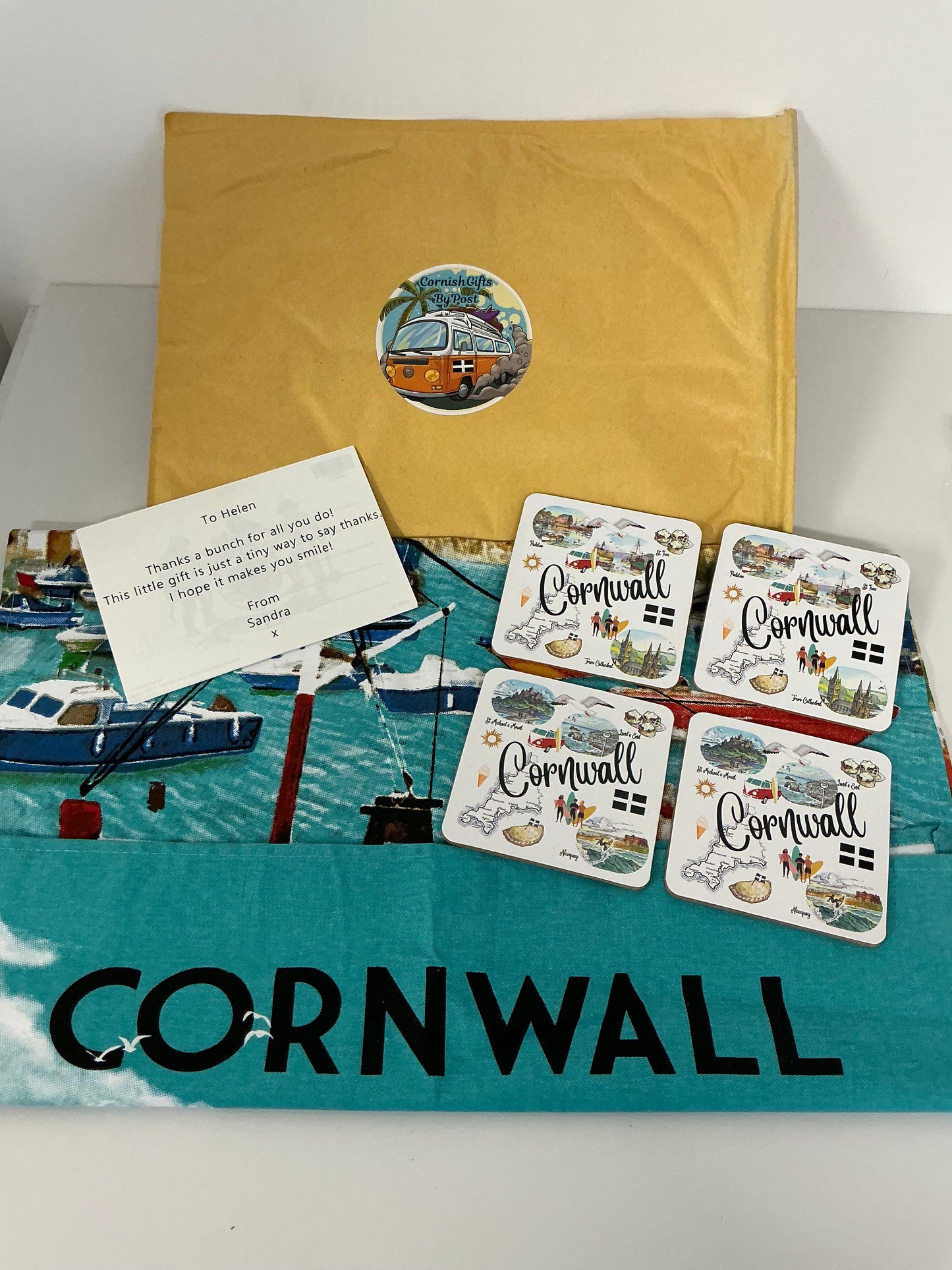 Cornwall tea towel with 4 Cornwall landmarks coasters and a personalised Cornwall postcard