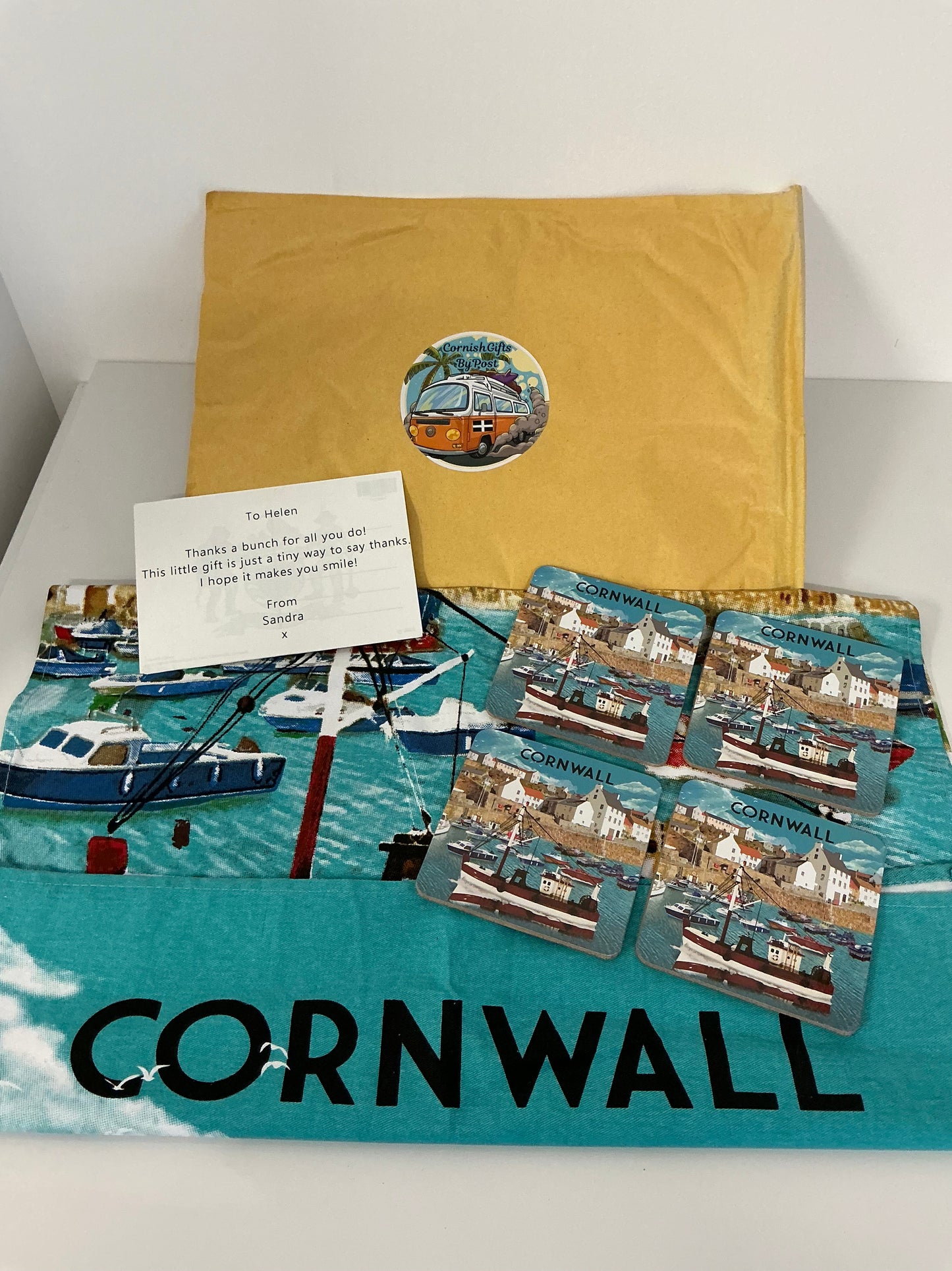 Cornwall tea towel with a set of 4 matching coasters and a personalised Cornwall postcard